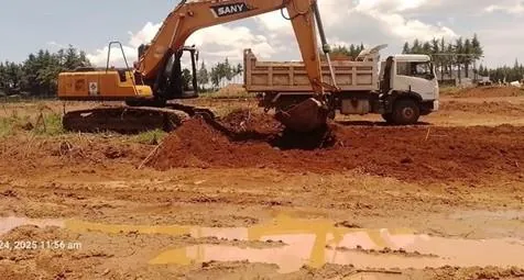 Excavator loading a dump truck